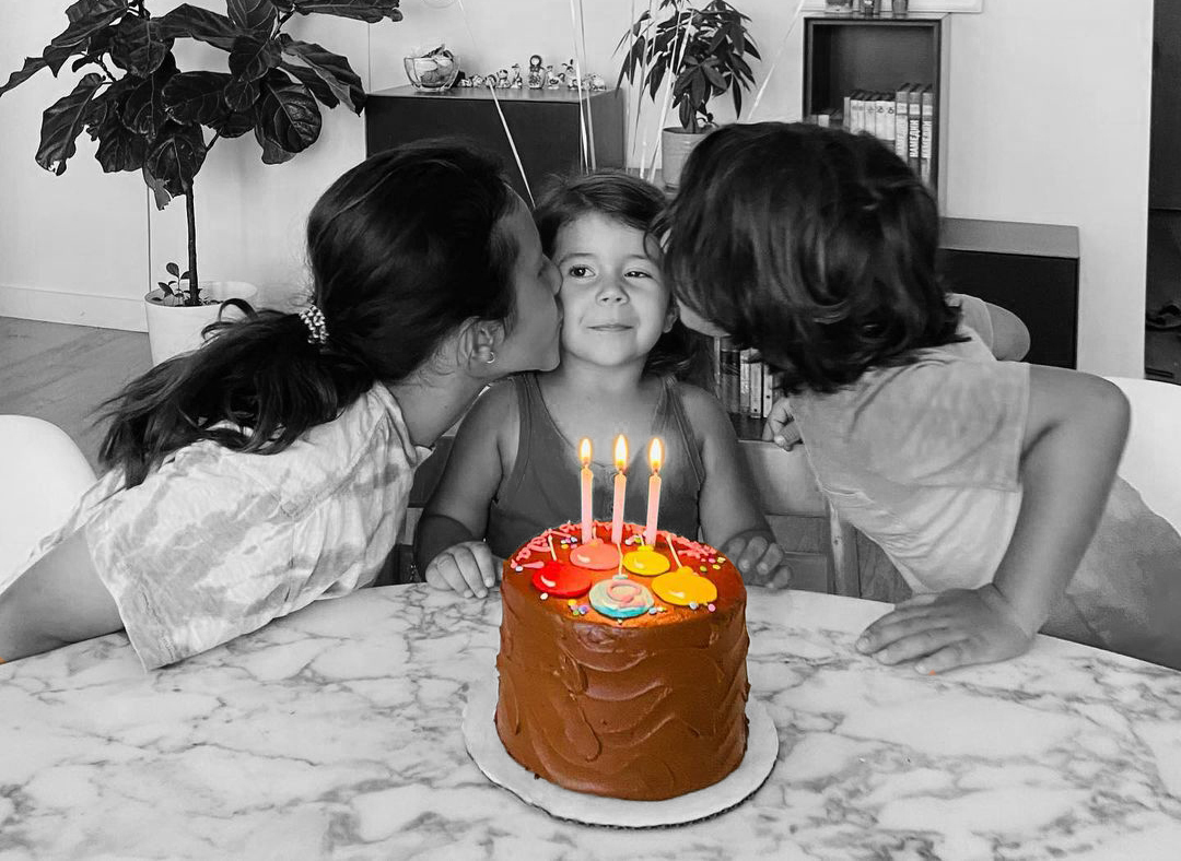 Boy celebrating his birthday with an old-fashioned chocolate cake 