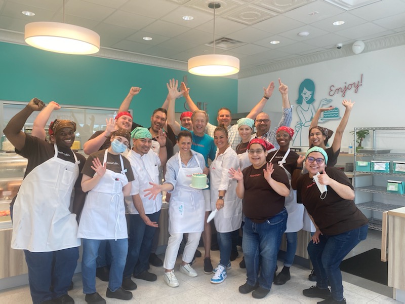 SusieCakes team celebrating a new bakery grand opening 