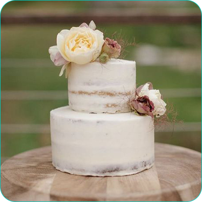Two tier white wedding cake with flowers
